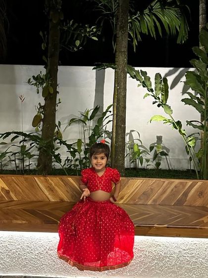 Little Kaanana sitting pretty in her custom red lehenga. I always ensure the outfits for kids are comfortable and easy to move in.
