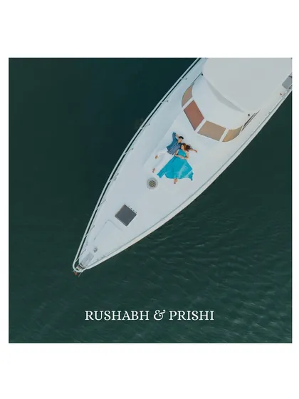 A breathtaking aerial view of a couple finding their own world on a luxury yacht in Goa. This drone shot captures the scale of the ocean and the intimacy of their moment together.