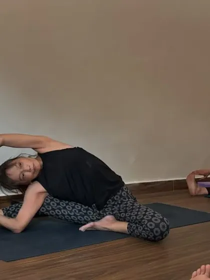 A student in Parivrtta Janu Sirsasana, a revolved head-to-knee pose. This shows the dedication of our practitioners to exploring deep twists and side bends.