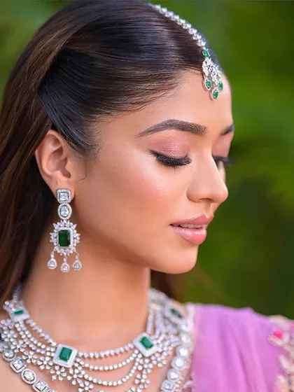 A close-up of the client's flawless makeup and sleek hair.