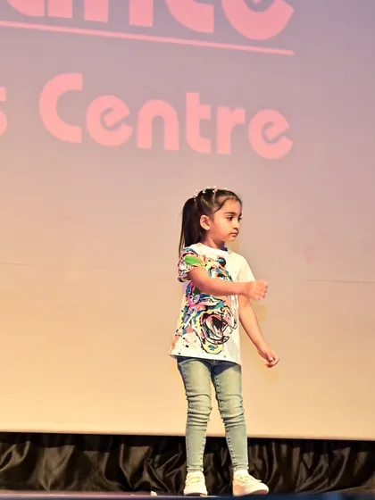 A graceful moment from Anaira's solo performance on stage.