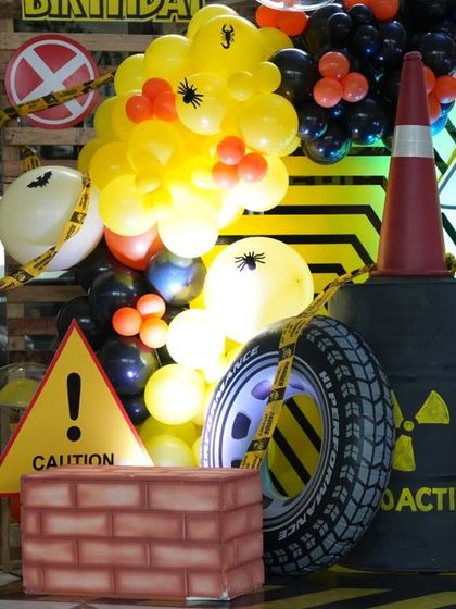 More details from the Fear Factor party, including radioactive barrels, traffic cones, and spider-webbed balloons to complete the spooky and exciting look.