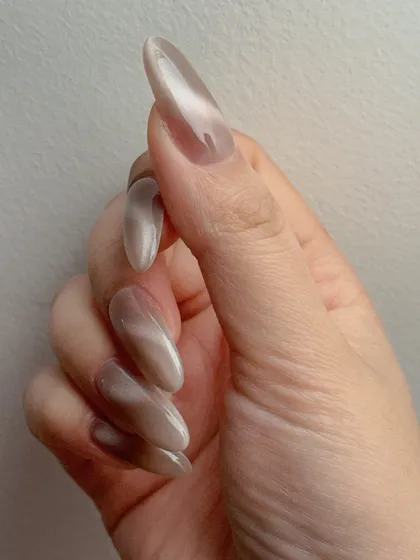 The beauty of this nude cat-eye is in its subtlety. It gives the nails a natural-looking glow and dimension.