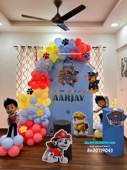 A dynamic Paw Patrol theme for Aarjav's birthday. The balloon arch is designed to look like a rainbow, with character cutouts ready for action.