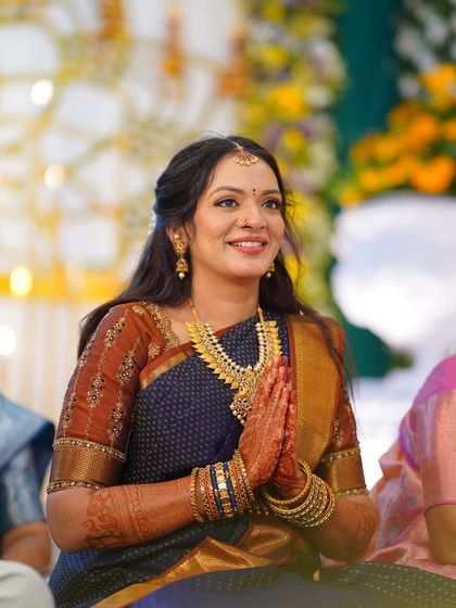 A beautiful candid from an engagement ceremony. Her makeup is soft and romantic, with a natural glow that looks stunning in the event lighting.