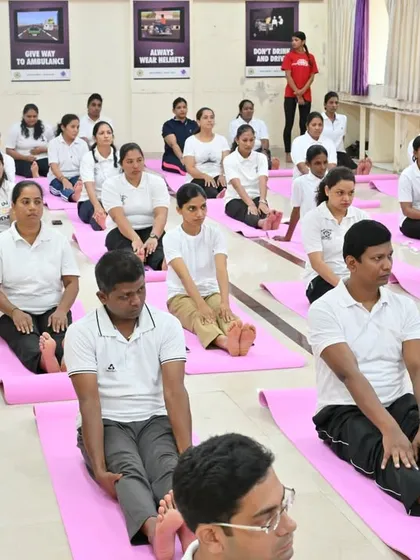 A session with the Mumbai Traffic Police, focusing on seated stretches to improve flexibility and circulation. These simple practices can be done during short breaks to rejuvenate the body and mind.