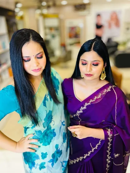 Two clients showing off their party makeup. I created coordinated looks with a focus on beautiful, shimmery eye makeup.