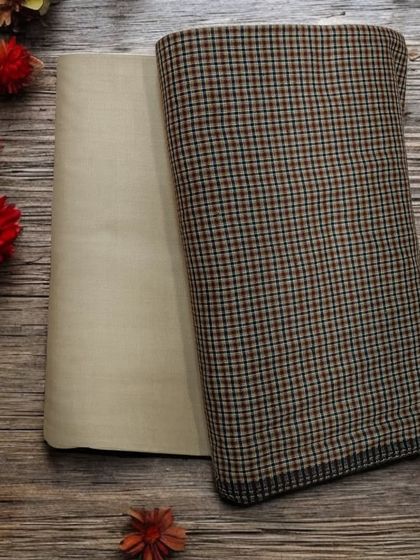 This earthy brown plaid woolen fabric is perfect for creating a cozy and stylish winter coat or jacket.