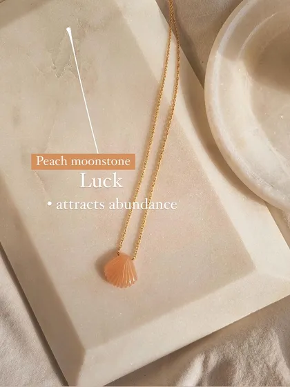 My peach moonstone shell pendant, a charm for luck and abundance. This piece from my beach shell collection combines the energy of the ocean with the good fortune of moonstone.