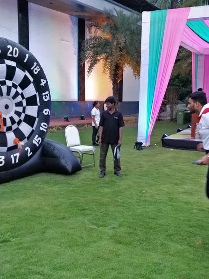 Our Giant Inflatable Dartboard is a safe and fun game for outdoor events. Players throw sticky, velcro-covered balls to score points, making it a great competitive game for parties.