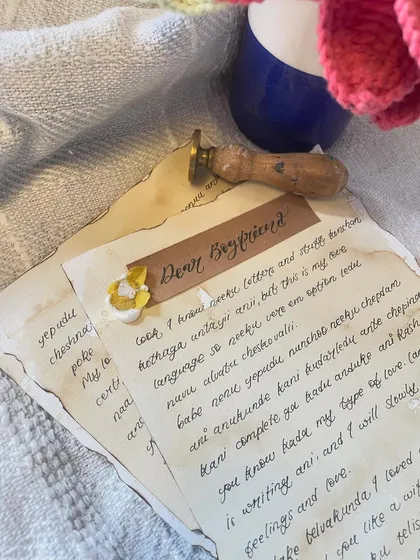 A close-up of one of my custom handwritten letters. I use coffee-staining to give the paper that lovely vintage feel, and every word is penned with care. It’s all about creating something that feels personal and `khaas`.