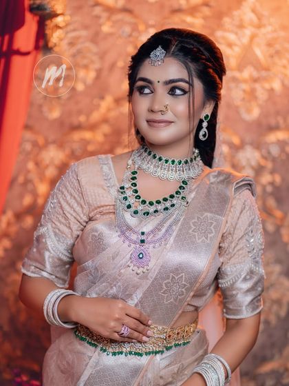 A side-profile shot that captures the elegance of the hairstyle and the drop earrings from our diamond-look collection.