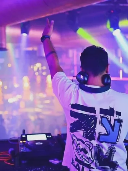 A view from behind, as I command the dance floor at BOHO. My focus is always on the crowd, feeling their energy and keeping the party going.