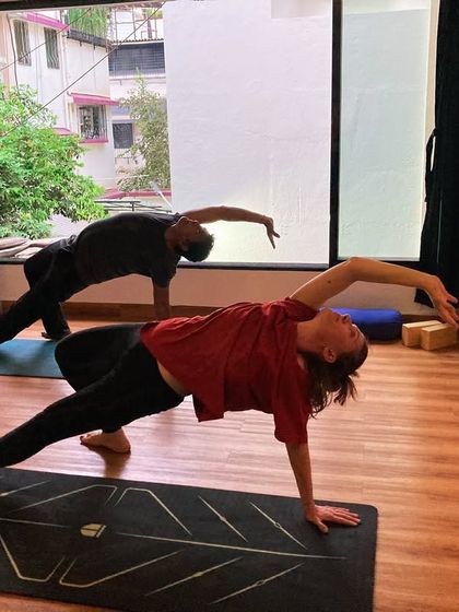 The wild thing pose, or Camatkarasana, is a beautiful heart-opener that builds strength and grace. My students flow into the pose during a group session.