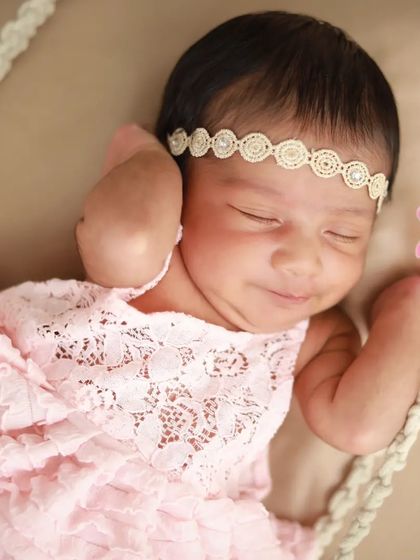 Such a sweet, sleepy smile. Capturing these little expressions while they dream is one of the best parts of my job.