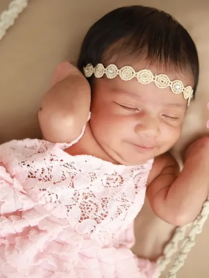 Such a sweet, sleepy smile. Capturing these little expressions while they dream is one of the best parts of my job.