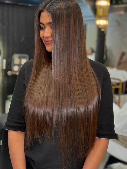The shine on this chocolate brown hair is incredible. We always finish our color services with a treatment to ensure the hair is healthy and glossy.