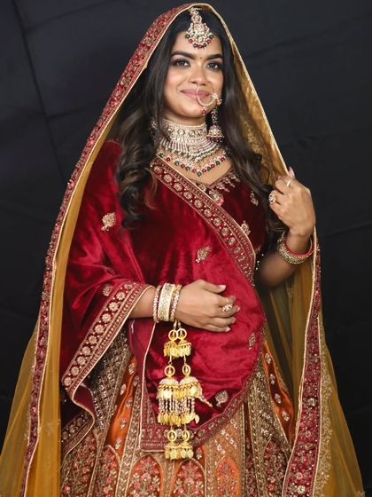 The complete look with the velvet lehenga and contrasting yellow dupatta, adorned with traditional kalire.