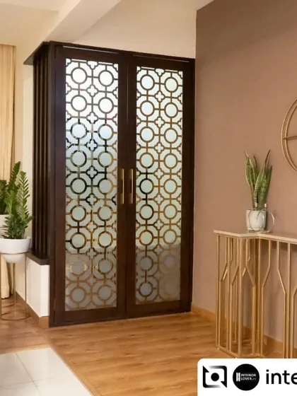 This elegant partition was designed to create a sense of entry and separation for the puja area without closing it off completely. The geometric jaali pattern allows light to pass through while adding a beautiful decorative element.