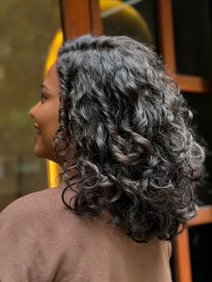This brave client donated her hair for a great cause. I gave her a stylish and manageable short curly cut that looks amazing and feels liberating.