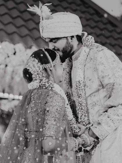 A tender forehead kiss, captured in timeless black and white. A simple, powerful expression of love.