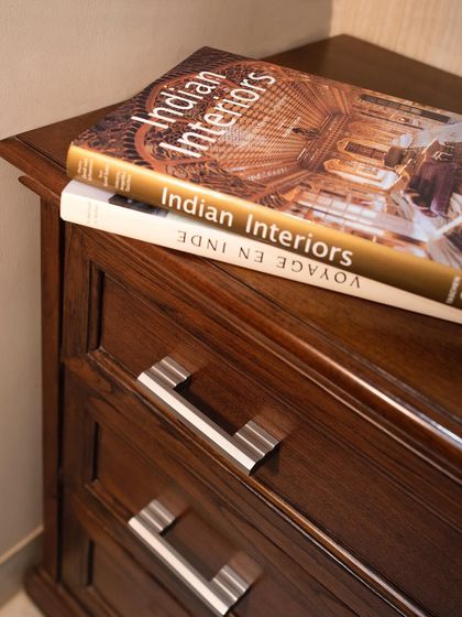 At the Reddy residence in Hyderabad, our contemporary cabinet handles in a brushed nickel finish provide a sleek contrast to the traditional dark wood drawers.