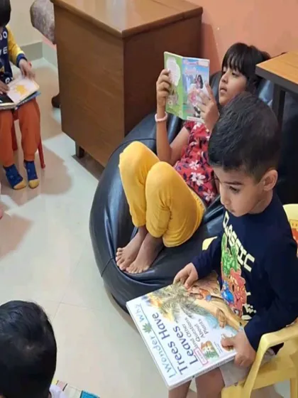 Children find their own favorite spots to read, whether it's on a chair, a bean bag, or the floor.