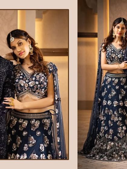 Twinning in navy blue. This couple chose matching outfits with intricate silver floral embroidery for a sophisticated and coordinated look.