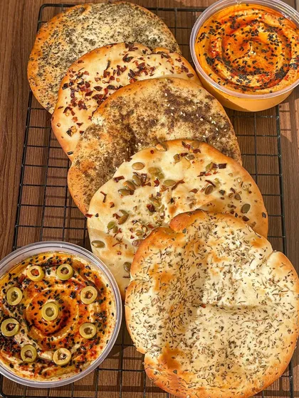 My Mediterranean Box includes five freshly baked pita pockets in assorted flavors, along with two types of hummus.