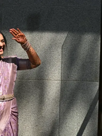 A playful wave in the sunlight. This bride is wearing a lovely lavender Kanjeevaram saree for another engagement function, showcasing my versatility with different color palettes.