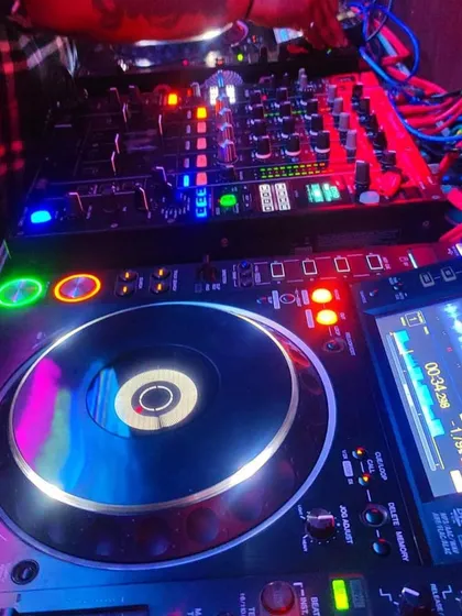 A close-up of my Pioneer mixer and deck. This is top-of-the-line equipment that ensures a professional sound and gives me full creative control over the music.