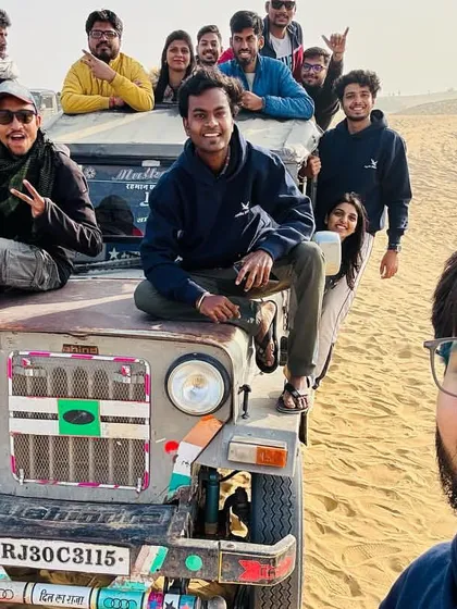 A group selfie on a jeep during the desert safari. The excitement is palpable.