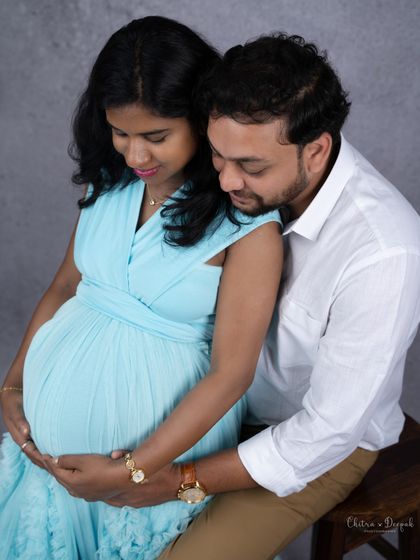 An intimate close-up showing the couple's hands on the baby bump. This shot is all about connection and the new life they've created together.
