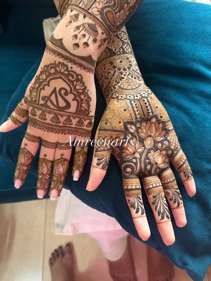 Another view of the 'AS' initial design, showing how the elements are balanced across both hands for a harmonious look.