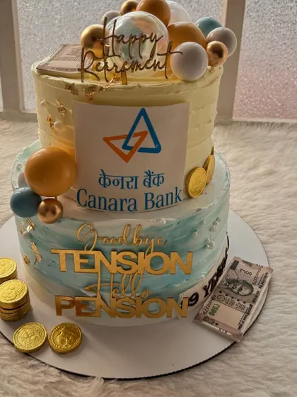 Another angle of the fun retirement cake, showing the playful message and festive decorations.