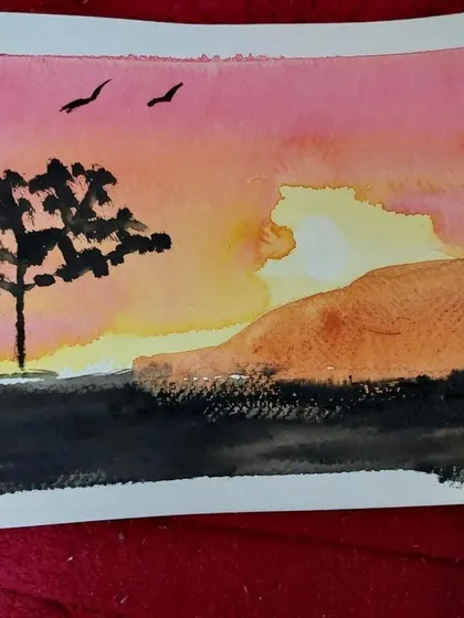 A simple yet beautiful sunset landscape created by a student, showcasing the lovely color washes typical of watercolor.