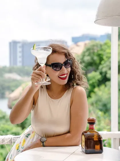 A cheerful toast to the camera from the Olive Bistro lifestyle shoot. This engaging shot captures the joy of a day out, making the location seem inviting and lively.