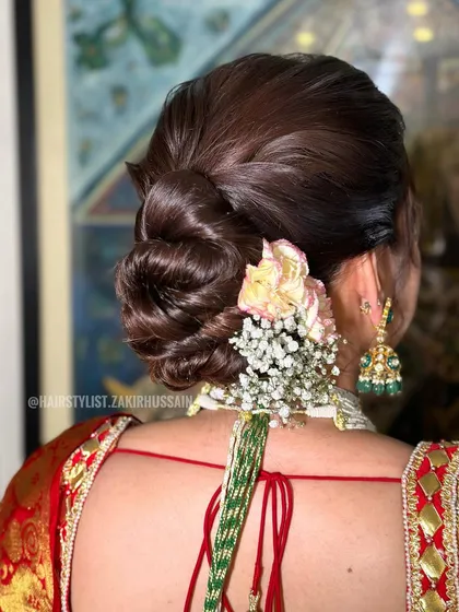 Another view of the classic floral bun, showing the placement of the flowers to create a full and beautiful arrangement.