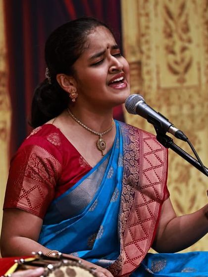 A close-up of me singing at the Cleveland Thyagaraja Festival. Even when performing for an international audience, the core of my music remains rooted in the tradition and devotion of Carnatic classicism.