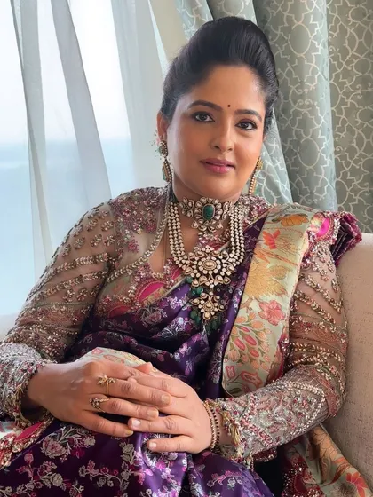A seated portrait showing how the makeup and entire look come together. The client looks poised, confident, and absolutely stunning.