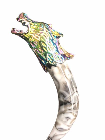 A truly unique brooch featuring a sculpted wolf's head with an iridescent finish, mounted on a marbled acrylic stick. This is a bold, artistic piece for those who want to make a statement.