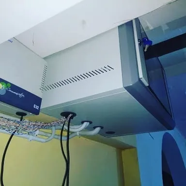 A neat and organized control unit is key for a reliable security system. This is a finished setup with the DVR and all wiring properly managed inside a secure, wall-mounted rack.
