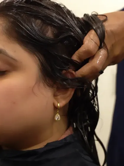 This is the heart of my Protein Shake Hair Spa. I meticulously work the nourishing formula into every strand, ensuring deep penetration to repair and strengthen your hair from within.