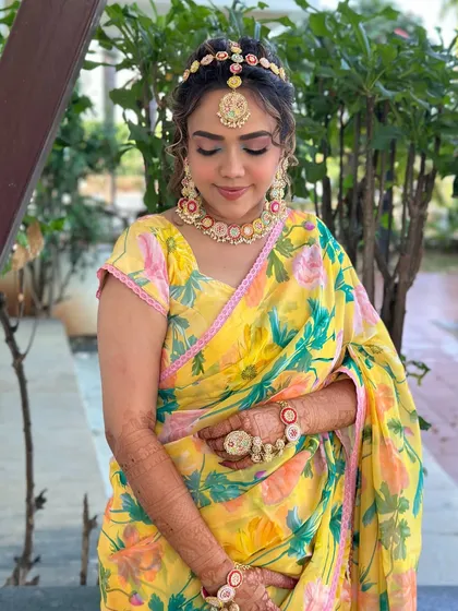 Another angle of this dreamy Haldi look. The makeup is kept minimal to let the vibrant colors and beautiful accessories shine.