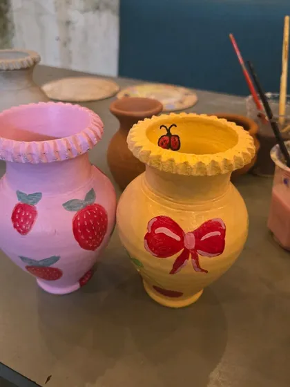 Your team will leave with more than just memories. These colorful, hand-painted pots are examples of the unique keepsakes everyone gets to create and take home.