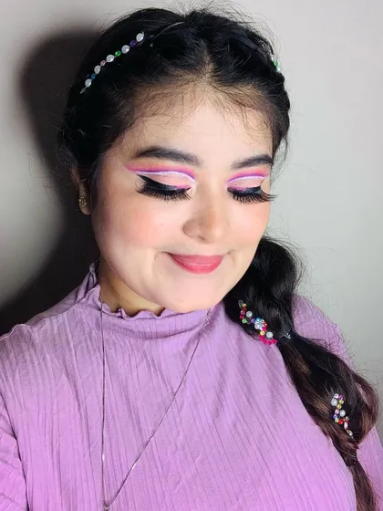 Another shot of the angelic purple makeup, showing the clean lines and vibrant colors.