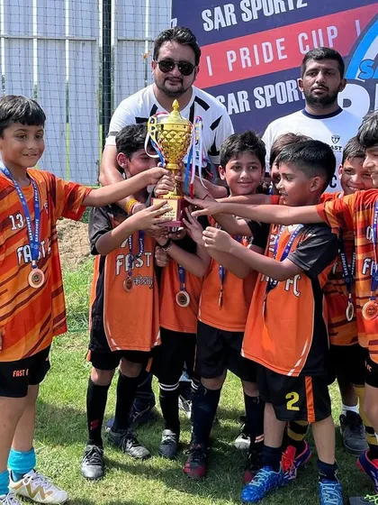 Our U8 players celebrating their runners up position in the Pride Cup. Early exposure to tournaments is a core part of our youth development philosophy.
