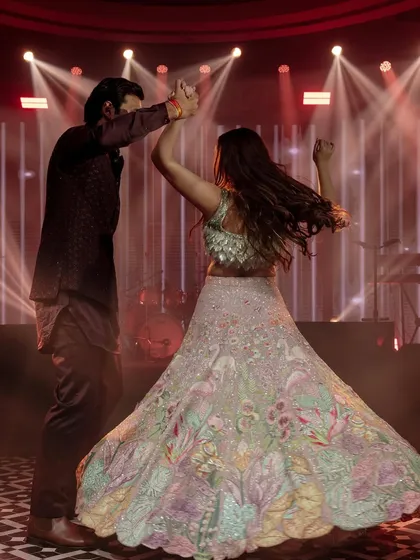 Khushboo and Varddan set the dance floor on fire at their engagement party. The twirl of her stunning lehenga and their joyful expressions show that dancing the night away was a top priority.