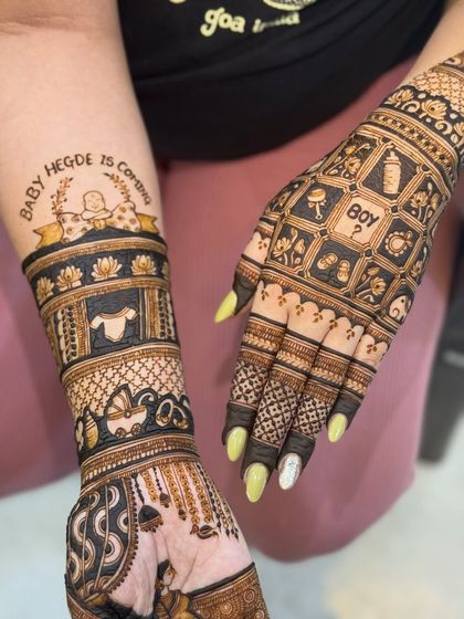 This baby shower design includes a banner announcing "Baby Hegde is Coming" and a fun "Boy?" block, adding to the excitement.