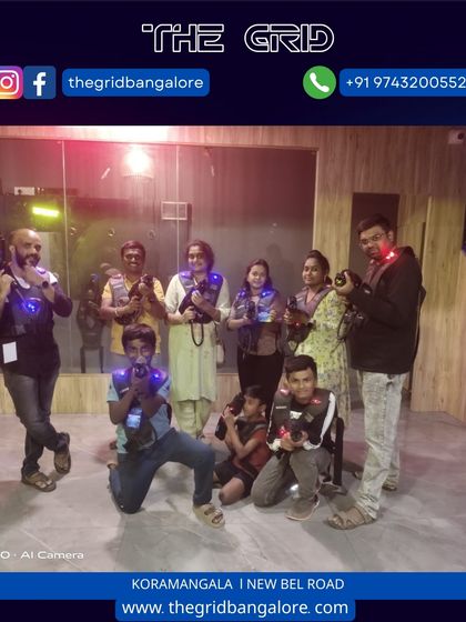 A large family group poses for a photo in our laser tag arena.